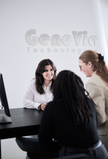 Genevia Technologies team together at the office.